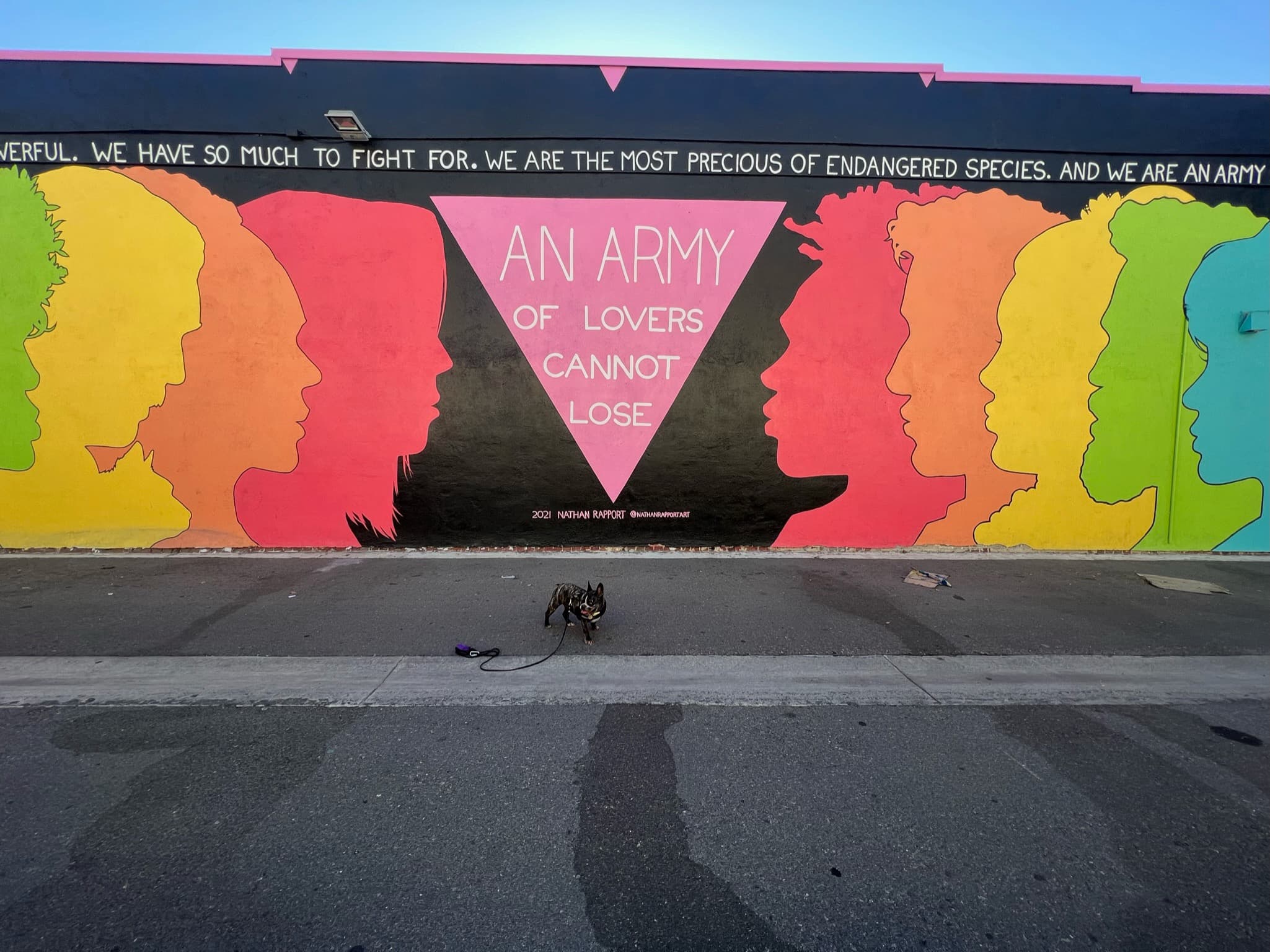 Maddie standing in front of street art in Arts District, Los Angeles