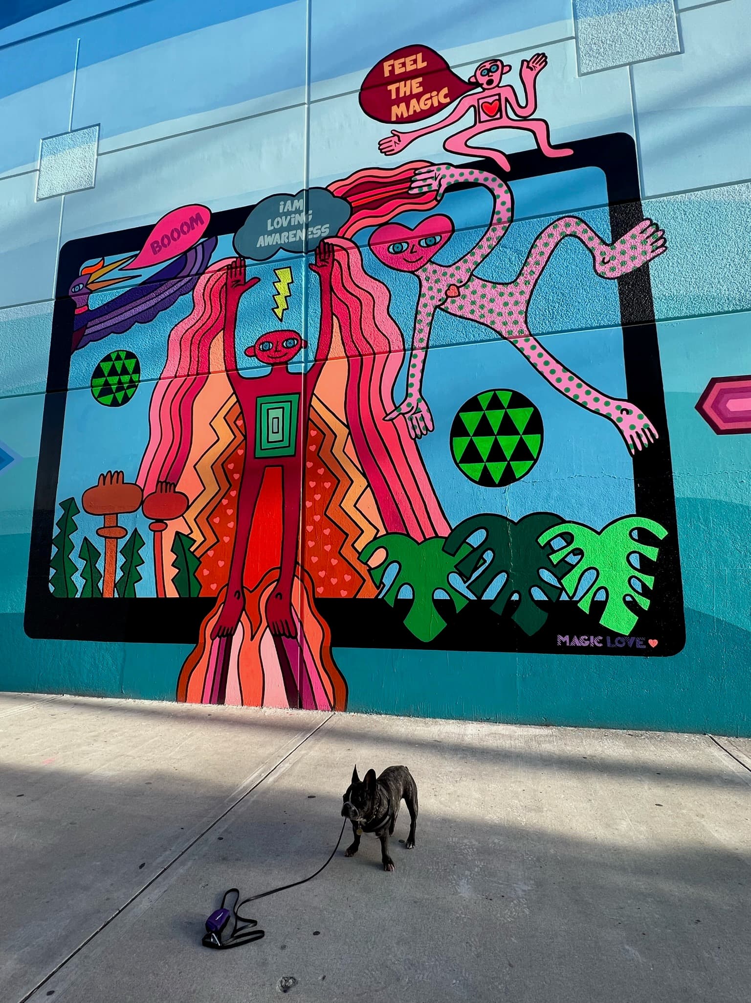 Maddie standing in front of street art in Arts District, Los Angeles