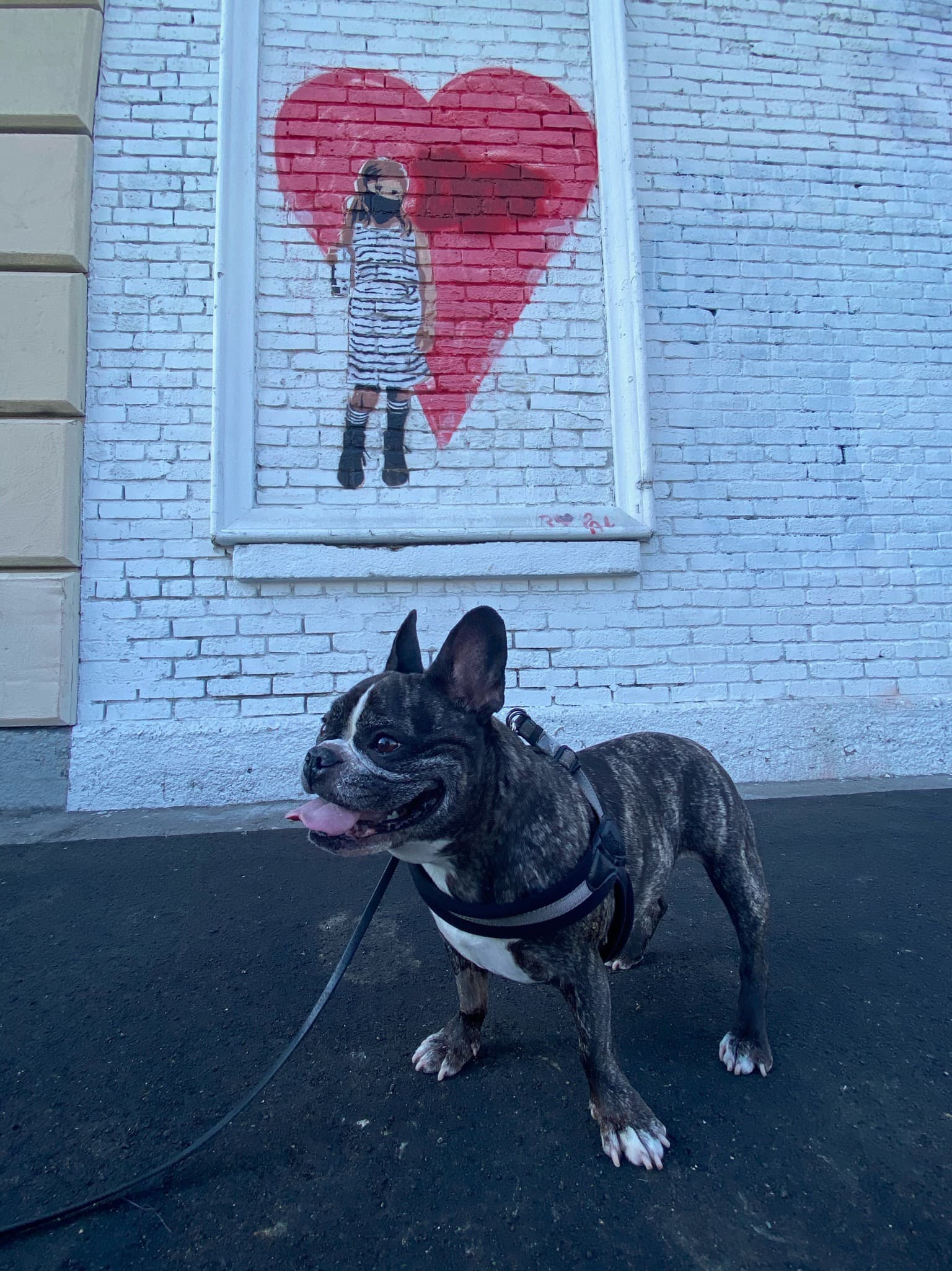 Maddie standing in front of street art in Arts District, Los Angeles