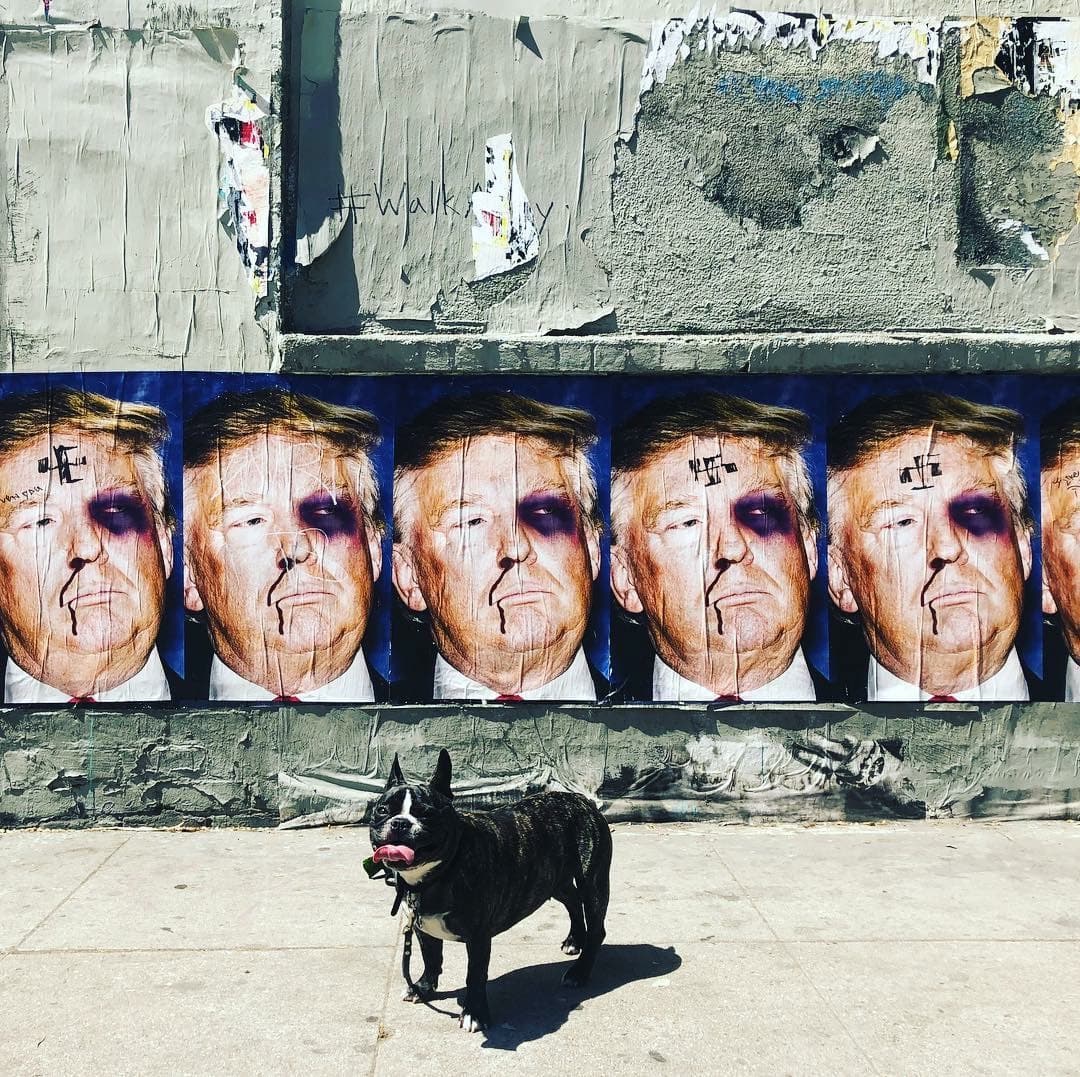 Maddie standing in front of street art in Needs location, Location unknown